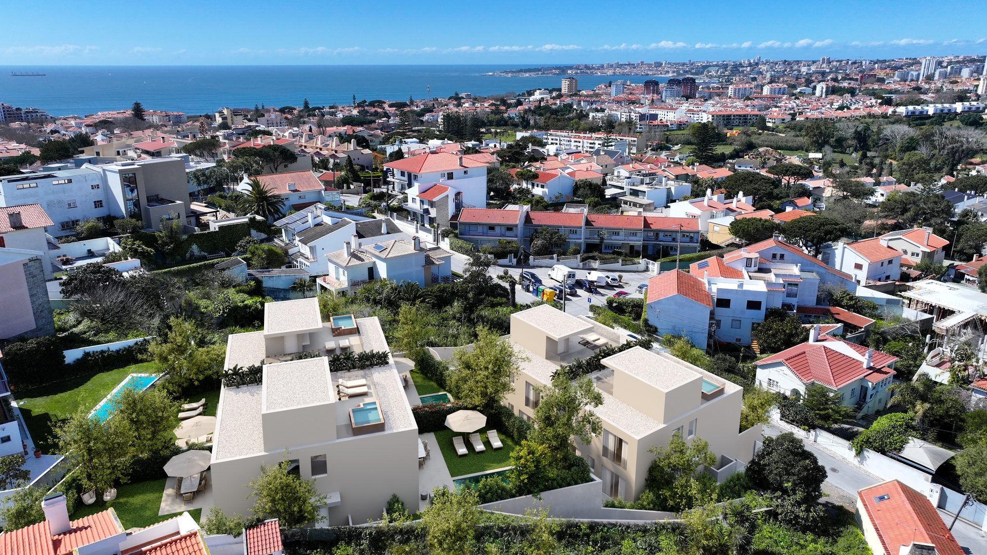 Vista aérea do condomínio com o mar em fundo